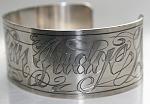 Tattoostyle engraves cuff bracelet.